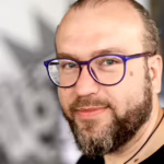 Роман Мінін